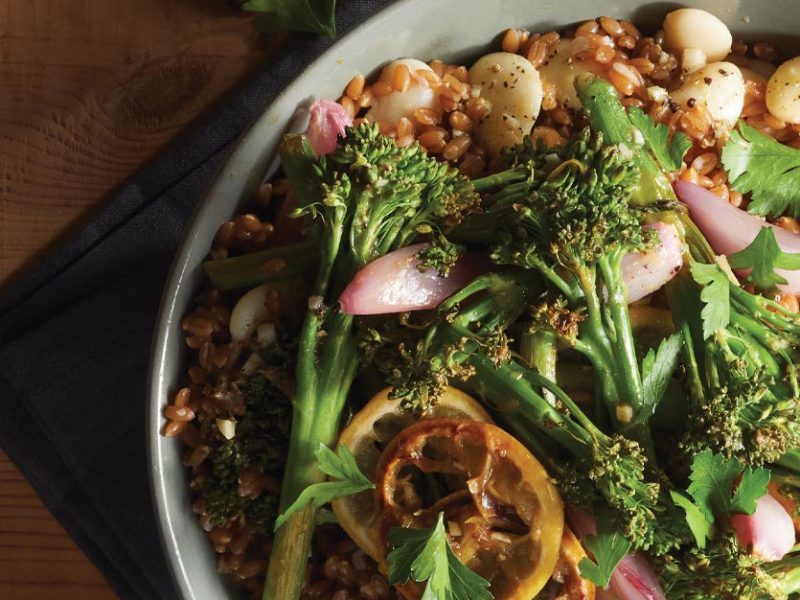 Lemony Spelt Salad with Roasted Broccolini in a shallow gray bowl