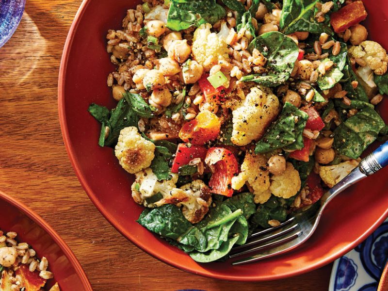 Moroccan Bean Salad in an orange bowl with a metal fork