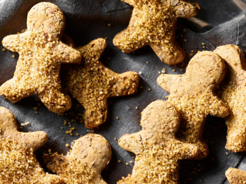 Vegan Gluten-Free Gingerbread Cookies on a dark blue linen cloth in a silver tray