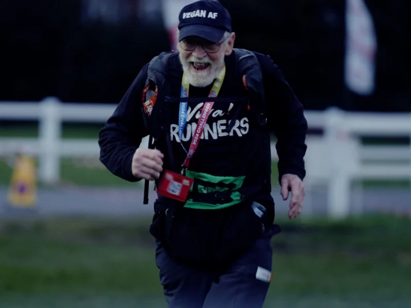 88-year-old vegan ultrarunner Paul Youd running and smiling